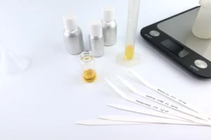 How are aroma chemicals used in perfume manufacturing?